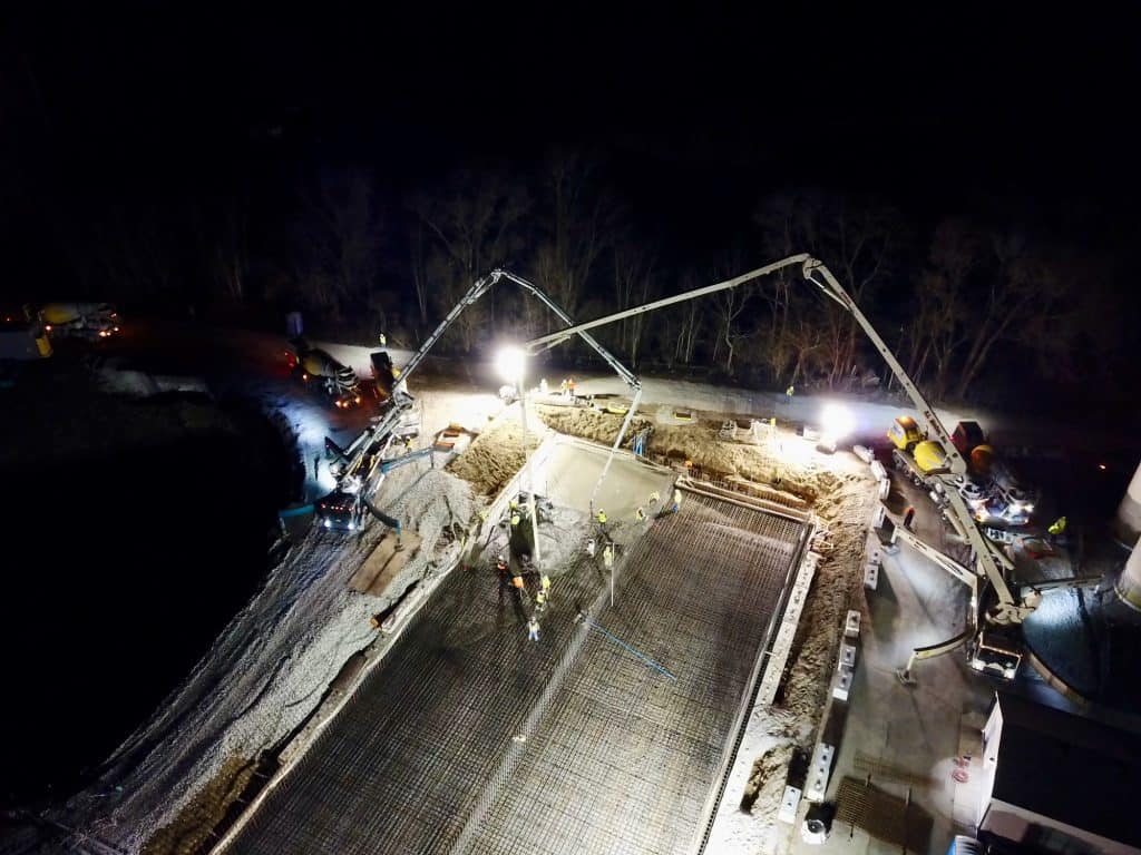 Concrete pumping during ready mix delivery to well expansion project